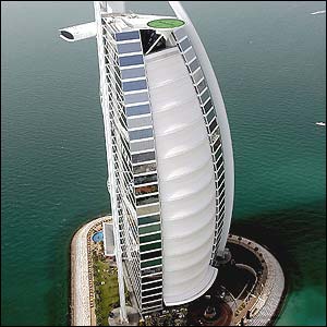 Andre Agassi and Roger Federer share a practice session on a helipad at Dubai's most luxurious hotel