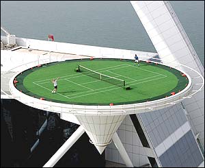 Andre Agassi and Roger Federer share a practice session on a helipad at Dubai's most luxurious hotel