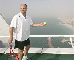 Andre Agassi and Roger Federer share a practice session on a helipad at Dubai's most luxurious hotel