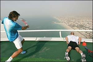 Andre Agassi and Roger Federer share a practice session on a helipad at Dubai's most luxurious hotel
