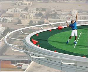 Andre Agassi and Roger Federer share a practice session on a helipad at Dubai's most luxurious hotel